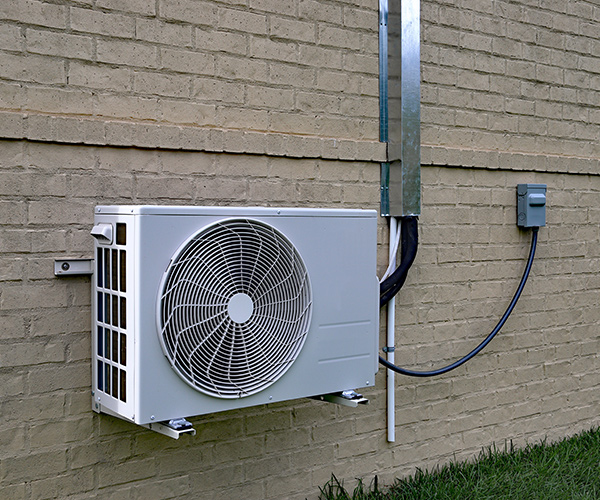 Photo of ductless condenser outside of the house